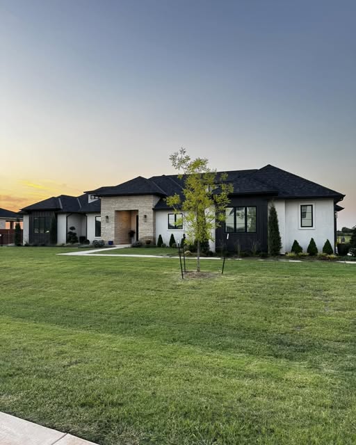 Beautiful Oklahoma home at dusk with XPEL window film installed by Tint My House OKC